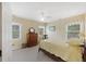 Calm bedroom with a single bed, and three large windows bringing in natural light for a comfortable atmosphere at 7879 Gull Bay Dr, Awendaw, SC 29429