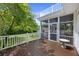 Spacious wooden deck with white railings offers a serene outdoor space for relaxation and entertaining at 7879 Gull Bay Dr, Awendaw, SC 29429