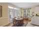 Charming dining area featuring French doors that open to a beautiful outdoor space at 7879 Gull Bay Dr, Awendaw, SC 29429