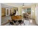 Bright dining area with tile flooring, a sailboat decor, and ample natural light from windows and french doors at 7879 Gull Bay Dr, Awendaw, SC 29429