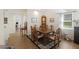 Inviting dining room with wood table, patterned rug, and view to another room, perfect for Gathering gatherings at 7879 Gull Bay Dr, Awendaw, SC 29429