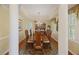 Elegant dining room showcasing a large wooden table, chandelier, and decorative columns at 7879 Gull Bay Dr, Awendaw, SC 29429