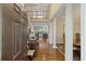 Elegant foyer featuring hardwood floors, a staircase, and an open view into the living and dining areas at 7879 Gull Bay Dr, Awendaw, SC 29429