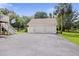 Detached garage with two bays, ample parking space, and an American flag displayed proudly at 7879 Gull Bay Dr, Awendaw, SC 29429