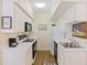 Efficient kitchen with white cabinets, black appliances, and ample counter space for easy meal preparation at 7879 Gull Bay Dr, Awendaw, SC 29429