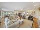 Open living space with hardwood floors, comfortable seating, and seamless flow to other rooms at 7879 Gull Bay Dr, Awendaw, SC 29429