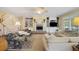 Inviting living room featuring a fireplace, built-in bookshelves, and natural light at 7879 Gull Bay Dr, Awendaw, SC 29429