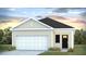 Charming single-story home featuring a single car garage, neutral siding, and professionally landscaped front yard at 8010 Rackham Rd, Hollywood, SC 29470