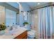 Clean bathroom with tiled shower, vanity, and natural light at 8938 Planters Row Ln, Summerville, SC 29485
