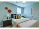 Cozy bedroom with stylish decor, a comfortable bed, and ample natural light at 8938 Planters Row Ln, Summerville, SC 29485
