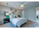 Comfortable bedroom featuring a ceiling fan and cozy bedding, creating a relaxing retreat at 8938 Planters Row Ln, Summerville, SC 29485
