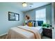 Comfortable bedroom featuring a ceiling fan and decorative pillows for a relaxing atmosphere at 8938 Planters Row Ln, Summerville, SC 29485
