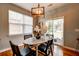 Charming dining area featuring a marble table and lots of natural light from windows at 8938 Planters Row Ln, Summerville, SC 29485