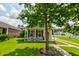 Charming two-story home with a welcoming front porch and well-maintained landscaping at 8938 Planters Row Ln, Summerville, SC 29485