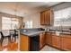 Well-lit kitchen featuring stainless steel appliances, sleek countertops, and dining area at 8938 Planters Row Ln, Summerville, SC 29485