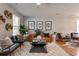 Inviting living room featuring stylish decor, a cozy rug, and ample natural light at 8938 Planters Row Ln, Summerville, SC 29485