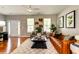 Inviting living room with neutral walls, stylish seating, and ample natural light at 8938 Planters Row Ln, Summerville, SC 29485