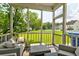 Cozy screened porch featuring comfortable seating and view of the lush backyard at 8938 Planters Row Ln, Summerville, SC 29485