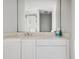Bright bathroom featuring a white vanity with a large mirror and a glass-enclosed shower at 9002 Palmetto Dr # 420, Isle of Palms, SC 29451