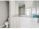 Bright bathroom featuring a white vanity, large mirror, and a glass-enclosed shower at 9002 Palmetto Dr # 420, Isle of Palms, SC 29451