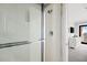 Close up of a shower, looking into the main bedroom with balcony access and ocean views at 9002 Palmetto Dr # 420, Isle of Palms, SC 29451