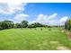 Expansive driving range with lush green grass and a row of wooden tee stations, perfect for golf practice at 9002 Palmetto Dr # 420, Isle of Palms, SC 29451