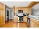 Well-equipped kitchen with stainless steel appliances and warm wood cabinetry at 9002 Palmetto Dr # 420, Isle of Palms, SC 29451