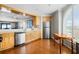 Bright kitchen with stainless steel appliances and a breakfast bar leading to the living area at 9002 Palmetto Dr # 420, Isle of Palms, SC 29451