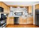 Modern kitchen featuring stainless steel appliances and a convenient breakfast bar at 9002 Palmetto Dr # 420, Isle of Palms, SC 29451