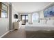 Bright main bedroom featuring balcony access and beach views through plantation shutters at 9002 Palmetto Dr # 420, Isle of Palms, SC 29451