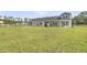 Backyard view featuring grassy lawn and the exteriors of multiple homes in the community at 913 Dusk Dr, Summerville, SC 29486