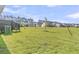 Spacious backyard featuring green grass and a view of the back of other homes in the community at 913 Dusk Dr, Summerville, SC 29486