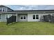 A well-maintained backyard with a cozy patio area and green lawn, perfect for outdoor entertaining at 913 Dusk Dr, Summerville, SC 29486