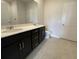 Bathroom featuring double sink vanity, modern fixtures, and a large mirror at 913 Dusk Dr, Summerville, SC 29486