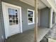 Inviting exterior featuring new vinyl siding and a white front door and windows at 913 Dusk Dr, Summerville, SC 29486