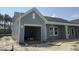 Side view of home with open garage showing lumber on garage floor at 913 Dusk Dr, Summerville, SC 29486