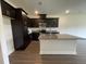 Beautiful kitchen with dark cabinetry, stainless steel appliances, and a large island at 913 Dusk Dr, Summerville, SC 29486