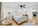 Bright bedroom with a white metal bed frame, a ceiling fan, and hardwood floors at 920 Simmons Ave, Summerville, SC 29483