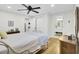 Bedroom with white walls, wood floors, and a door leading to the bathroom at 920 Simmons Ave, Summerville, SC 29483