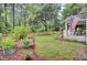 Charming home with a well maintained front yard, picket fence and an inviting porch with an American flag at 920 Simmons Ave, Summerville, SC 29483