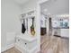 Hallway with bench and coat rack leading to kitchen and living room area at 920 Simmons Ave, Summerville, SC 29483