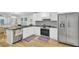 Stylish kitchen with stainless steel appliances, white cabinets, and a view into the living area at 920 Simmons Ave, Summerville, SC 29483