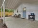 Inviting patio with comfortable seating, a small table, and a view of the lush backyard, perfect for relaxation at 920 Simmons Ave, Summerville, SC 29483