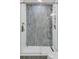 Modern shower enclosed with glass featuring blue tiled walls and a built-in niche at 920 Simmons Ave, Summerville, SC 29483