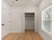 Bedroom with wood floors, a closet, and a window at St, Charleston, SC 29407