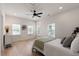 Bedroom with wood floors, a ceiling fan, and multiple windows for ample natural light at St, Charleston, SC 29407