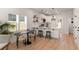 Well-lit kitchen with white cabinets, pendant lighting, and a breakfast bar with seating at St, Charleston, SC 29407