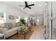 Bright open-concept living space with hardwood floors, natural light, and modern finishes with living room and kitchen at St, Charleston, SC 29407
