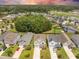 Aerial view of a residential neighborhood showcasing well-maintained homes, green spaces, and a pond, offering a desirable community at 106 Sago Ct, Summerville, SC 29486