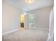 Spacious bedroom with carpet, white walls and an adjacent bathroom at 106 Sago Ct, Summerville, SC 29486